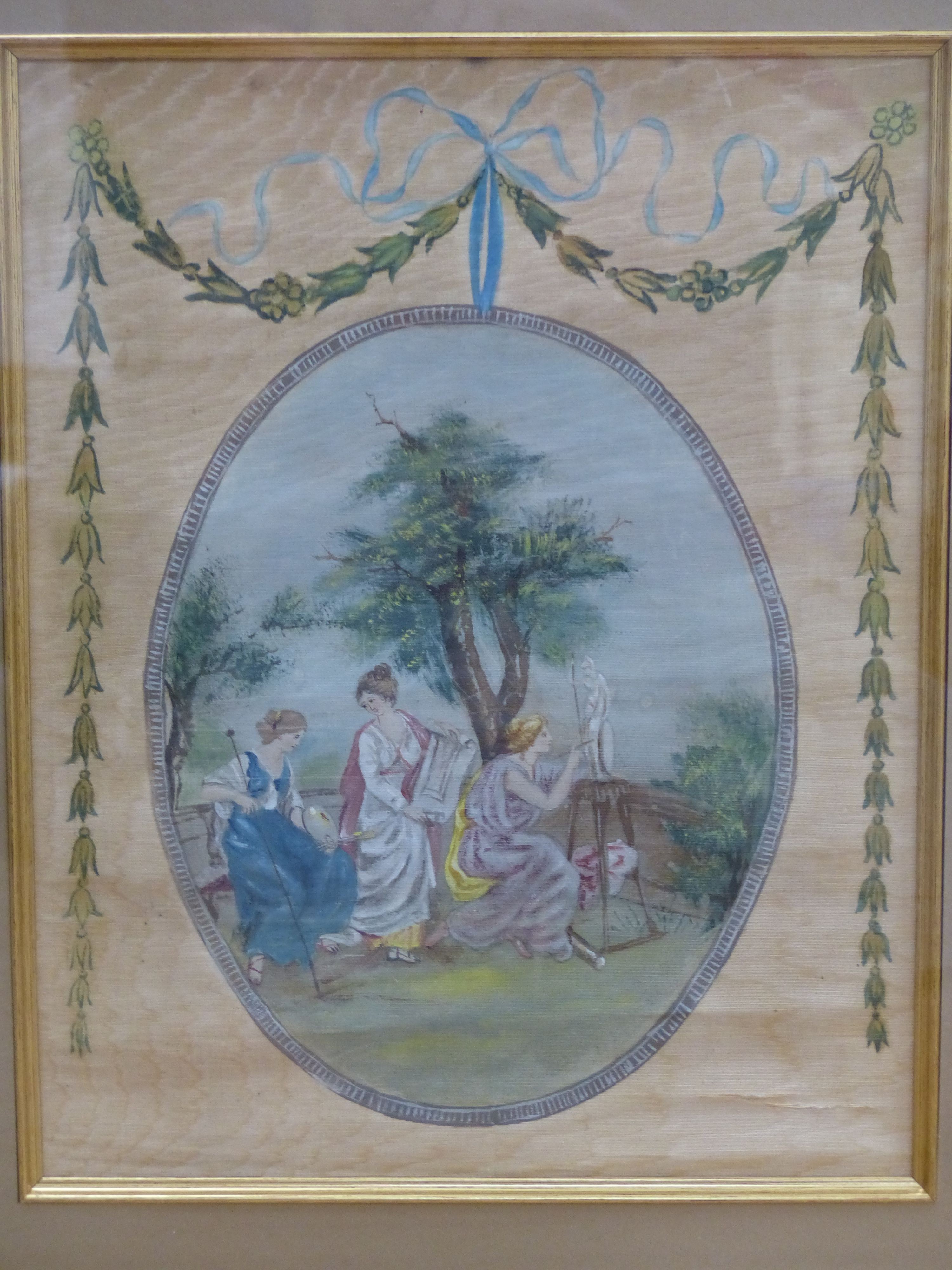 A set of three Edwardian painted silk panels depicting classical muses, 35 x 27cm